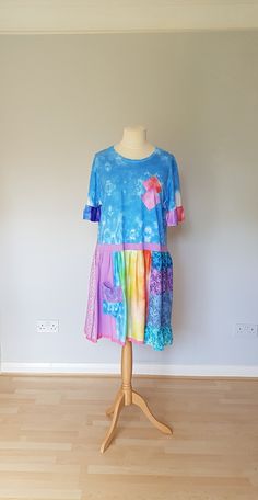 Tie dye dresses for women, Rainbow dress women, Plus size clothing for women, Upcycle tunic dress, Upcycled clothing, Bohemian dress plus, One of a kind rainbow upcycled tie dye tunic/ dress made from upcycled clothing and  brand new fabric. Stretchy, soft and comfortable. Decorated with laces.  Can be worn with jeans, leggings or as a dress. Size XL Measurements bust - 46" and stretches easily  length - 40" Machine washable in 30 degrees on wrong side. There is a lot of outstanding designs in d Flowy Patchwork Short Sleeve Dress, Summer Patchwork Relaxed Fit Dresses, Hippie Hand Dyed Dresses For Spring, Blue Short Sleeve Lagenlook Dress, Bohemian Short Sleeve Patchwork Dress, Flowy Tie-dye Dress, Flowy Hand-dyed Tie Dye Dresses, Flowy Hand-dyed Tie-dye Dresses, Bohemian Hand-dyed Tie-dye Dress