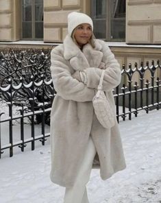 Material: 100% Faux Fur Wrap yourself in elegance with our Long Faux Rabbit Coat. Crafted from high-quality faux fur, this coat mimics the softness and allure of real rabbit fur, providing a luxurious feel. The extended length adds a touch of drama and warmth, making it a chic choice for colder seasons. Whether you're attending a special event or want to elevate your everyday style, the Long Faux Rabbit Coat combines fashion with compassion, ensuring you make a statement with both warmth and gra Cream Faux Fur Coat Outfit, Long Fur Coat Outfit, White Fur Coat Outfit, Mantel Outfit, Fur Coat Outfit, White Faux Fur Coat, Winter Coat Outfits, Long Fur Coat, White Fur Coat