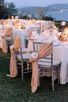 the tables are set with white and pink linens