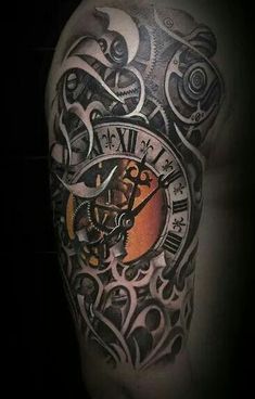 a man's arm with a clock tattoo on it