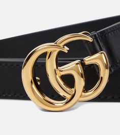 Gucci’s famed GG logo may be decade-old but it’s in accessories like this belt that its timeless allure really shines through – and quite literally so. Made from gleaming gold-toned brass, it’s one of fashion's most coveted and instantly recognizable symbols. Here, it brings unabashed refinement to the overall pared-back black leather profile..Color of fastening: gold.Made in Italy.Material: cow leather.Width 2cm-1'.Buckle width 3cm-1' Gold Leather Belts With Gold-tone Logo Plaque, Chic Formal Belts With Metal Logo, Gold Belt With Logo Plaque For Formal Occasions, Designer Formal Belt With Gold-tone Logo Plaque, Gold Leather Belt Buckle With Metal Logo, Gold Leather Belt Buckle With Logo Plaque, Designer Gold Belt Buckles With Logo Plaque, Modern Formal Belt Buckles With Logo, Modern Gucci Belts For Formal Occasions