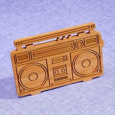 a wooden brochure shaped like a boombox