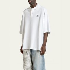 Balenciaga piqué polo shirt  Spread collar; two-button placket Embroidered logo at chest Short sleeves Oversized fit Pullover style Cotton/polyester Made in Portugal Polo Oversize, Oversized Polo Shirt, Oversized Polo, Balenciaga Mens, Pique Polo Shirt, Button Placket, Oversized Fits, Pullover Styling, Balenciaga