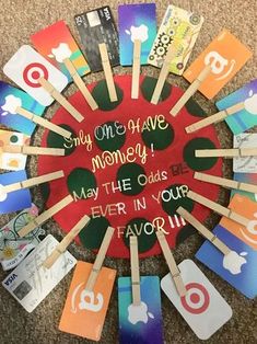 there is a circle made out of many different colored cards and toothbrushes with the words stay one's have money, may the odds ever in your favorite place