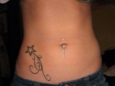 a woman's stomach with an initial tattoo on her lower body and bottom part