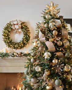 a decorated christmas tree in front of a fireplace