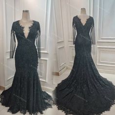 the back of a black lace dress with long sleeves and open shoulders, on display