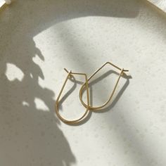 These 14k gold hoops are perfect for everyday wear. Named after the Greek goddess of wisdom and strength, these earrings will elevate your look each time you reach for them. Each purchase comes with an elegant, vegan leather box for storing + caring for your jewelry. DETAILS14k Solid Gold | 1 1/8" in length, 5/8" wide Gold 14k Threader Earrings For Everyday, Everyday 14k Gold Threader Earrings, Gold Sterling Silver Hoop Earrings For Everyday Elegance, Gold-toned Sterling Silver Hoop Earrings For Everyday Elegance, Yellow Gold Teardrop Hoop Earrings For Everyday, 14k Gold Oval Earrings For Everyday, Everyday Yellow Gold Teardrop Huggie Earrings, Minimalist Teardrop Gold Plated Hoop Earrings, Everyday Yellow Gold Teardrop Hoop Earrings