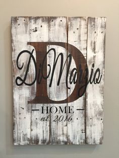 a wooden sign with the letter d on it