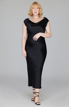 Our signature bias cut silhouette, updated with a gracefully draped front and back neckline that provides the perfect amount of coverage and can be worn on the shoulder or in a slightly asymmetrical and slouchy way. Cut in a flattering midi length with a clean baby hem finish. This dress is unlined and needs no closures thanks to the nature of bias cut fabric. Asymmetrical Neckline Midi Dress For Night Out, Bias Cut Cowl Back Midi Dress For Night Out, Formal Silk Cowl Back Dress, Evening Midi Dress With Bias Cut And Cowl Neck, Cowl Neck Bias Cut Evening Dress, Sleek Slip Dress With Cowl Neck For Evening, Cowl Neck Bias Cut Dress For Evening, Bias Cut Cowl Neck Evening Dress, Fitted Silk Evening Dress With Cowl Back