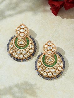 Indulge in the opulent allure of our designer Chand Baali earrings, meticulously crafted with intricate fancy polkis complemented by a palette of mesmerizing agate beads. Perfectly suited for the grandeur of festive celebrations, weddings, and chic soirées, these earrings seamlessly blend with both traditional Indian attire and contemporary fusion ensembles. Each piece embodies the essence of luxury, crafted with authentic semi-precious stones for an unmistakably regal touch. Finish: 22KT Gold P Chandbali Earrings, Beautiful Rose Flowers, Indian Attire, Traditional Indian, Online Earrings, Agate Beads, Agate Stone, Brass Color, Beautiful Roses