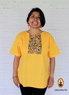 This hand-embroidered blouse is very versatile and comfortable. It's super elegant and the fine embroidery makes it more unique to wear on any occasion. Each Blouse that we sell is authentic and one-of-a-kind and it is made love by Mexican artisans. Note: Earrings are not included Cotton Embroidered Top With Resham And Short Sleeves, Multicolor Embroidered Neckline Short Sleeve Blouse, Multicolor Embroidered Neckline Blouse With Short Sleeves, Multicolor Embroidered Short Sleeve Blouse, Short Sleeve Cotton Top With Resham Embroidery, Cotton Short Sleeve Top With Resham Embroidery, Cotton Short Sleeve Blouse With Resham Embroidery, Traditional Short Sleeve Blouse With Embroidered Border, Cotton Embroidered Top With Resham Embroidery Short Sleeve