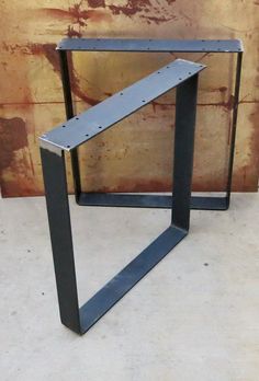 a metal table that is sitting on the ground