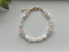 Modern and elegant, this beaded statement bracelet features a mix of aquamarine, rose quartz, agate and freshwater pearl in various shapes and sizes. Clasp and extender chain are 14k Gold filled. Soft and muted colors go with practically any outfit! Bracelet length is available in various sizes but custom lengths are also available - specify in a message along with your order. Pink Quartz Bracelet, Pastel Bracelet, Bracelets Design, Fairy Necklace, Rose Quartz Earrings, Rose Quartz Bracelet, Pearl Pink, Beads Bracelet Design, Handmade Jewelry Tutorials