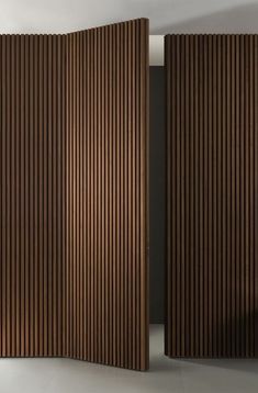 a room divider made out of wooden slats