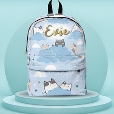 This adorable back-to-school Kawaii cat backpack will be the talk of the class. With a classic look that never goes out of style, durable construction, and details for all-day carrying comfort, this customizable backpack is a must-have for the daily commute to school or occasional casual travel. This backpack will add color to any of your journeys.  FREE personalized name choice at check out. We'll include the font and name of your choice on the print. This is included on the designed print. IS Kawaii Backpack With Cat Design For Students, Kawaii Cat Design Backpack For Students, Cute Student Backpack With Cat Design, Kawaii Backpack With Cat Design For Daily Use, Cute Backpack With Cat Design For Back To School, Cute Cat Design Backpack For Travel, Cute Cat Design Backpack, Cat Design Backpack For Back To School, Kawaii Cat Design Backpack For Everyday Use