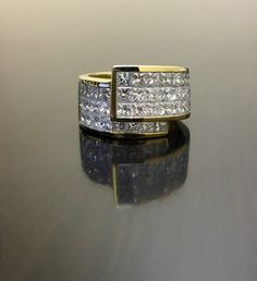 DeKara Designs Collection Metal- 18K Yellow Gold, .750.Stones- 40 Princess Cut Diamonds F-G Color VS2 Clarity 3.65 Carats.Size- 6 1/2.  FREE SIZING!!! Band is 12.65 MM in the front and tapers down to 7.9 MM in the back.Beautifully handmade 18K yellow gold diamond invisible princess cut engagement band.  This ring has a total of 40 beautiful and fiery princess cut diamonds that are all invisible set with perfection.  The band is entirely handmade and is extremely vibrant.  Band is heavy as well w Diamond Ring Princess Cut Wide Band, Designer White Wedding Rings, Designer Round Cut Wedding Jewelry, Designer Wedding Jewelry With Brilliant Cut, Designer Brilliant Cut Jewelry For Wedding, Designer Vvs Clarity Jewelry For Wedding, Luxury Princess Cut Pave Setting Wedding Ring, Modern Princess Cut Yellow Gold Jewelry, Vintage Princess Cut Yellow Gold Jewelry