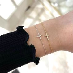 Our Esther Dainty Diamond Cross Bracelet is a glimmering beacon of faith. Stylish and elegant, this bracelet embodies the beauty of His grace. Perfect to shine on its own but sophisticated enough to add to a stack. The intentional delicacy of this design makes for the heartfelt gift of a child's first piece of fine jewelry or an adult's everyday dainty wear. Metal: 18k White Gold / 18k Yellow Gold / 18k Rose Gold Round Brilliant Cut Natural Diamonds: Approx. 0.10 ctw G Color and SI1-2 Clarity Diamonds Length: 7 inches at the longest. ﻿Adjustable sliding bead to provide options for smaller wrist size. Closure: Lobster clasp Measurements: Approx. 11.7mm length x 5.9mm width Looking for a different size? Please email us. Elegant Chain Bracelet With Pave Setting As Gift, Elegant Pave Setting Chain Bracelet For Gift, Elegant Sterling Silver Cross Rosary Bracelet, Timeless Tennis Bracelet With Pave Setting, Elegant Bracelets With Pave Setting As Gift, Elegant Bracelets With Pave Setting For Gift, Adjustable White Gold Bracelets With Pave Setting, Classic Chain Bracelet With Pave Setting As Gift, Timeless Diamond Bracelet With Pave Setting As Gift