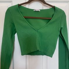 Order Will Ship Next Business Day! Zara Green V Neck Long Sleeve Cropped Shirt. Brand New Condition, Never Worn. No Holes/ No Stains! Woman’s Medium Fits True To Size. Stretchy Material That Molds To Your Body. Buttons On Front So You Can Change The Look Of The Shirt! Looks Great For Everyday Wear Or To Dress Up For A Special Occasion. Comfortable And Trendy. Coming From A Smoke Free And Clean Home! Cropped Shirt, Clean Home, Shirt Brand, Crop Shirt, Zara Tops, Stretchy Material, Looks Great, Everyday Wear, Long Sleeve Tees