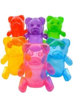 five different colored teddy bears sitting in a row