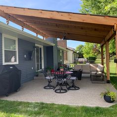 a patio covered with furniture and an awning