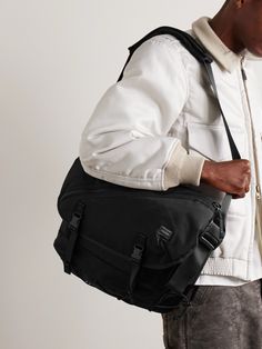 Porter-Yoshida & Co's messenger bag is part of the 'Things' collection, which features utilitarian-inspired details. It's made from hard-wearing nylon and has a padded shoulder strap and stretch cords at the base. Keep a 14-inch laptop, planner and your wallet and keys inside. Modern Shoulder Bag With Functional Pockets For Everyday, Modern Nylon Shoulder Bag With Multiple Pockets, Porter Yoshida, Messenger Bag Men, Mr Porter, Messenger Bag, Porter, Shoulder Strap, Bag Accessories