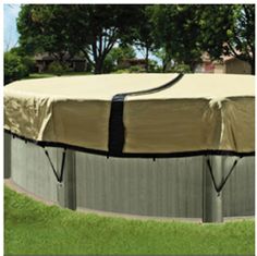 an above ground swimming pool covered with a cover