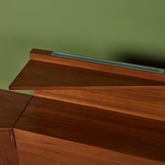 a close up view of the top of a wooden cabinet