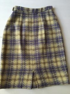 "Vintage 1960's Lavender Wool plaid skirt. The makers label is *A Ronbary Classic By Chicago Skirt Co.* Is a small petite size, so please go by the measurements below. Is lined just in the back of the skirt. Has a left side metal zipper with button. *SCROLL DOWN FOR MORE INFORMATION* CONDITION: No issues noted. MEASURES: Waist~22\" Hips~34\" Total length~21\" Under hem~1/2\" **WE APOLOGIZE~BUT WE CAN NO LONGER SHIP TO GERMANY, ITALY OR SPAIN. WE HAVE INCURRED TOO MANY ISSUES WITH SHIPPING. PACKA Vintage Purple Lined Skirt, Wool Plaid Skirt, 1960s Skirt, Plaid Skirt, Womens Skirts, Plaid Skirts, Wool Plaid, Metal Zipper, Petite Size