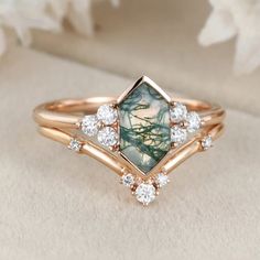 a close up view of a ring with an image of flowers in the center and diamonds on it