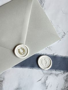 an envelope with two wax seals on it