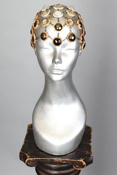 This is a one of a kind piece of wearable art made for the Five and Diamond Seventh Annual Headgear Art Show and shown on August 2, 2019. Intentional adornment - fits heads from 21”- 24” Designed by FoolProof Studio One of a kind Unisex MATERIALS USEDGlass and metal. WEARING INSTRUCTIONSThere’s slight difference with the front and the back side of the design. Front side worn with the black jewel at center of forehead (it’s is surrounded by smooth hematite cabochons). The back side, as a “layer” Handmade Adjustable Headpieces For Evening, Handmade Elegant Festival Headpiece, Handmade Adjustable Evening Headpieces, Unique Handmade Crown Headpiece, Elegant Handmade Festival Headpiece, Luxury Crown-shaped Jewelry For Parties, Luxury Crown Shaped Jewelry For Parties, Unique Handmade Ceremonial Headpieces, Elegant Handmade Ceremonial Headpieces