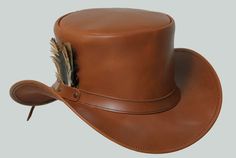 Hand Crafted Leather Premium Quality Leather Hat , Each Hat is Hand made  Description: we have multiple options in leather Color : Black , Dark Brown , Distress Brown , White , Silver , Maroon Redish  , Greenish Green ,  Tan Brown * High-Quality Craftsmanship handmade * Real Leather * 100% pure leather Sizing: XS 54 CM S 55-56 CM M 57-58 CM L 59 CM XL 60 CM XXL 61-62 CM Heads come in all sizes, and in a lots variety of shapes. Although high quality hats are adaptable, and will usually conform to differences in shape with a little wearing, it is essential that the size be correct for the head. To determine your hat size, measure the circumference around your head, keeping the tape level and firm, across the temples and above the eyebrow ridges. Check the size chart given below. For in-betwe Light Brown Top, Vintage Wedding Accessories, Leather Top Hat, Pale Rider, Steampunk Top, Brown Leather Top, Steampunk Top Hat, Steampunk Hat, Leather Hat