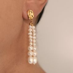 Details: Stainless steel. Water resistant. Freshwater pearls. Modern Everyday Pearl Earrings, Modern Pearl White Pearl Earrings For Gift, Modern Pearl Earrings For Anniversary, Modern Akoya Pearl Drop Earrings, Elegant Pearl Chain Earrings In Metal, Classic Metal Earrings With Pearl Charm, Classic Metal Pearl Earrings With Pearl Charm, Modern White Pearl Earrings With Pearl Chain, Modern Pearl Chain Earrings