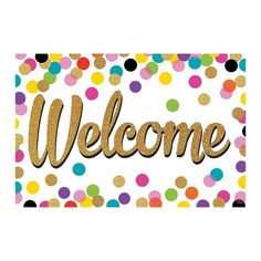 a welcome sign with confetti and gold foil lettering that reads,'welcome '