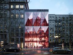 people are walking around in front of a building that has red triangles on the side