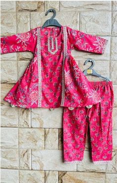 This exclusive Cotton Salwar kurta set is perfect for any occasion or function. It is a perfect combination of style, design and traditional wear Pink Pant Set With Dabka Work For Diwali, Pink Pant Set For Navratri, Pink Pant Set With Zari Work For Festivals, Cotton Sharara For Eid, Bollywood Style Pink Cotton Palazzo Set, Cotton Sharara With Bandhani Print For Diwali, Pink Cotton Anarkali Set With Printed Motifs, Pink Cotton Sets For Diwali, Diwali Cotton Sharara With Bandhani Print