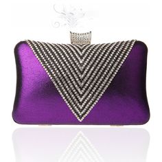 a purple clutch bag with diamonds on it