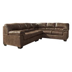 a brown sectional couch sitting on top of a white floor