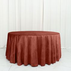 a round table with a red cloth on it