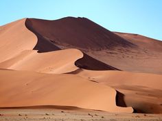 sand dunes in the desert with blue sky