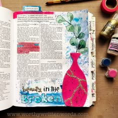 an open bible with watercolors and markers