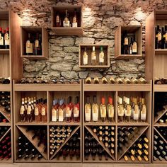 a wine cellar filled with lots of bottles