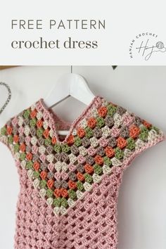 A pink granny stitch crochet dress with green, grey and cream stripes hangs on a hanger Cute Crochet Dress, Granny Dress, Fair Isle Crochet, Stitch Dress, Granny Stitch