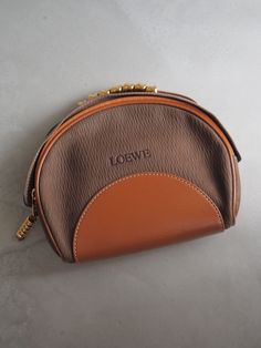 Welcome to my shop 100%AUTHENTIC GUARANTEED Description 【Brand】LOEWE 【Material】Leather 【Color】Brown 【Serial number】 【Comes with】Dust bag 【Control Number】249 【Size(inch)】H 6.0 x W 7.5 x D 2.1 inch Handle: 0.9 inch 【Size(cm)】H 15 x W 19 x D 5 cm Handle: 2 cm 【Condition 】 Outside: A : Rubbed Inside: A : Pocket: A : Shoulder Handle : A : Corner: A : Rubbed Rank Description N - Brand new, New old stock NA - Mint condition, Unused A - Near mint condition (almost no damage) AB - Near mint condition (in Loewe Vintage Bag, Loewe Vintage, Dop Kit, Lets Roll, Bangle Watches, Top Handle Bags, D 2, New New, Small Leather Goods