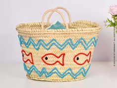 Perfect for Beach Vacations and Poolside Relaxation Make a splash this summer with our Embroidered Fish Motif Summer Bag. This unique beach tote is not only practical but also a fashion statement. The bag features a charming embroidered fish motif, adding a touch of whimsy to your beach or poolside look.The bag is spacious enough to hold all your summer essentials, from sunscreen to your favorite summer read. It's made from durable materials, ensuring it can withstand the rigors of summer advent Embroidered Natural Beach Bag For Vacation, Embroidered Beach Straw Tote Bag, Embroidered Straw Tote Bag For Beach, Embroidered Beach Bag For Travel, Embroidered Rectangular Straw Bag For Beach, Embroidered Straw Bag For Summer Travel, Embroidered Natural Bags For Beach, Embroidered Bucket Bag For Vacation, Blue Embroidered Vacation Bag