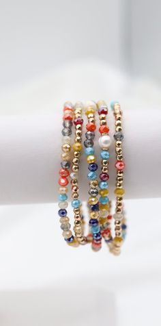 The Gold Multi Stone Bead Bracelet Set is a vibrant collection of bracelets adorned with an array of colorful stone beads, each accented with elegant gold touches. This set offers a versatile and eye-catching accessory option, perfect for adding a splash of color and sophistication to any outfit. Size: 6” - Inner Diameter Closure: Elastic Material: Zinc, Brass and Steel with Rhodium Plating Lead and Cadmium Safe - It is not Nickel Free Multicolor Spacer Beads Wrap Bangle Bracelet, Multicolor Spacer Bead Wrap Bangle Bracelet, Multicolor Spacer Beads Wrap Bracelet, Multicolor Beaded Wrap Bracelet, Gold Crystal Bracelet With Colorful Beads, Bohemian Multicolor Friendship Bracelets With Gold Beads, Adjustable Multicolor Jewelry With Gold Beads, Multicolor Faceted Beaded Bangle Bracelet, Multicolor Faceted Beads Bracelets For Jewelry Making