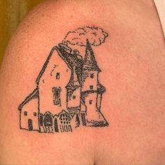 a black and white drawing of a house on the back of a man's shoulder