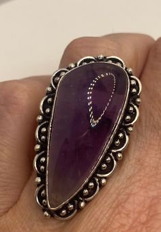 Vintage purple amethyst cocktail ring statement Large genuine free form amethyst Vintage ring Low content silver not sterling. Our jeweler charges a $20 re sizing fee. All rings are shipped free in the US in a nice gift box. Check out our over a THOUSAND great reviews Engraving is $4 per letter and is not always perfect depending on the piece. It can take a few days if the jeweler is busy. This is payable to Paypal Judithsltd@gmail.com Teardrop Amethyst Ring In Purple, Nickel-free Purple Rings For Jewelry Making, Elegant Purple Nickel-free Rings, Unique Purple Jewelry With Large Stone, Adjustable Oval Purple Amethyst Ring, Purple Teardrop Amethyst Ring, Bohemian Oval Amethyst Ring For Anniversary, Silver Amethyst Ring Collectible, Purple Ring With Large Stone Jewelry