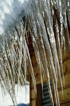 icicles hanging from the roof of a house